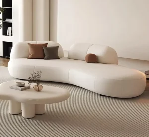 Luxury Curved Cream PU Leather Sofa Modern Minimalist Modular Sectional Couch with Round Pillows for Living Room Mall Hotel Use